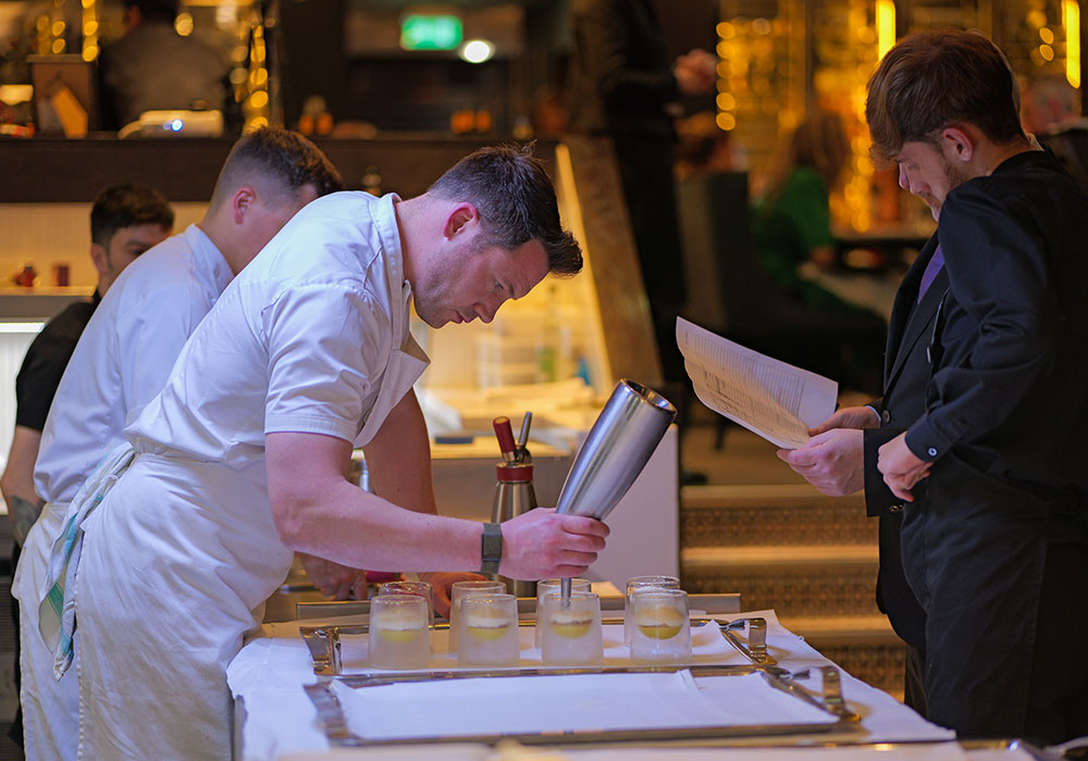 An Image of Tommy Banks prepping at Signature Food Festival 2024