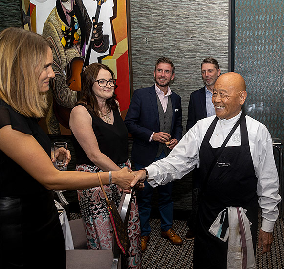 An Image of chef Ken Hom and his sponsors at Signature Food Festival